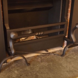 Clients antique dog irons used untouched with this Thermovent wood burning open fire. Three bar grate from with scroll twist.