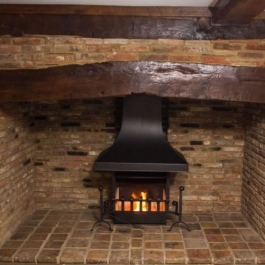 An anniversary Edition Thermovent high performance wood burning open fire in a newly modernisted cottage in Hertfordshire