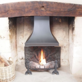 Hand made steel canopy in open fire where other company had installed large diameter liner but fire still smoked. Replaced previous canopy.