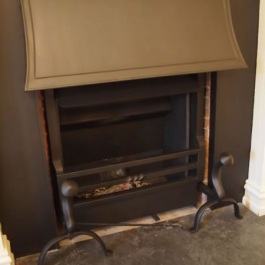 Inset panel used to cover unsightly brick previously built in on this fireplace. Thermovent wood burning open fire installed to give more heat with a period look.