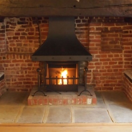 Large Inglenook with Camelot Thermovent open fire.