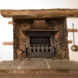 Rennovated cottage open fireplace with Thermovent high performance convecting fire.