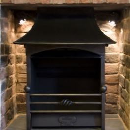 Small open fireplace with woodburning Thermovent high performance convecting open fire.