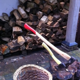 Splitting logs as we move them to the back of the house from the stores where they have been seasoned.