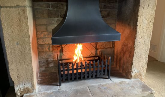 Steel inglenook canopy and spiked fire basket