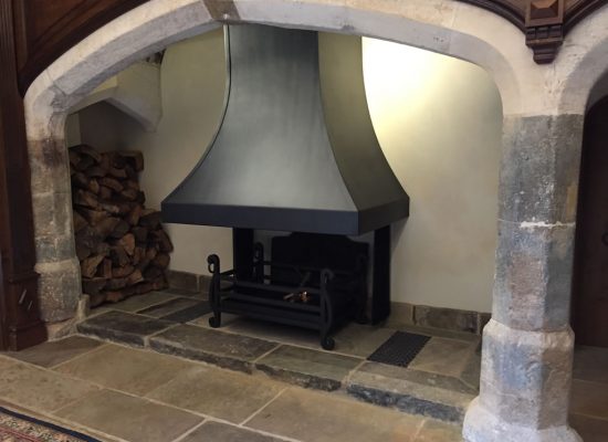 Large steel inglenook canopy and custom fire basket