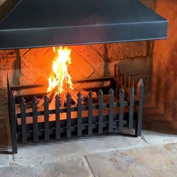 Hand forged fire basket with spear uprights and feature front spiked corners