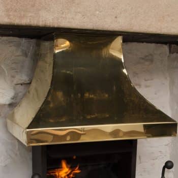 Large brass inglenook canopy with rivet detailing