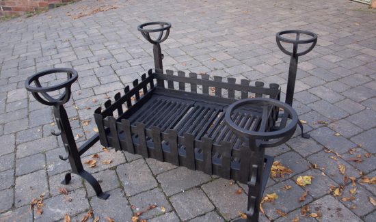 Bespoke large fire basket with four spit dog irons.