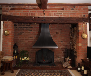 Inglenook canopy and intricate heavy fire grate.