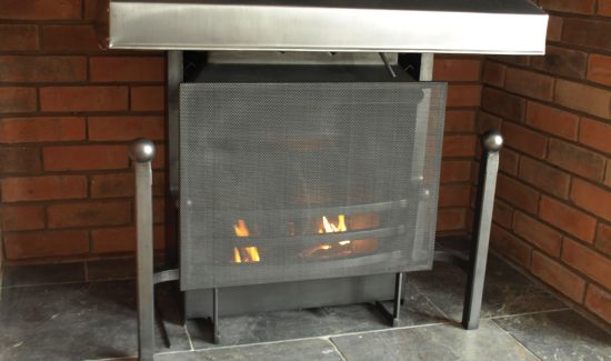 Bespoke fire guard and steel uncovered thermovent.