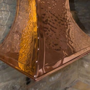 Hand beaten copper canopy with rivet detail